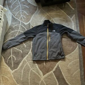 Grey and black North Face jacket